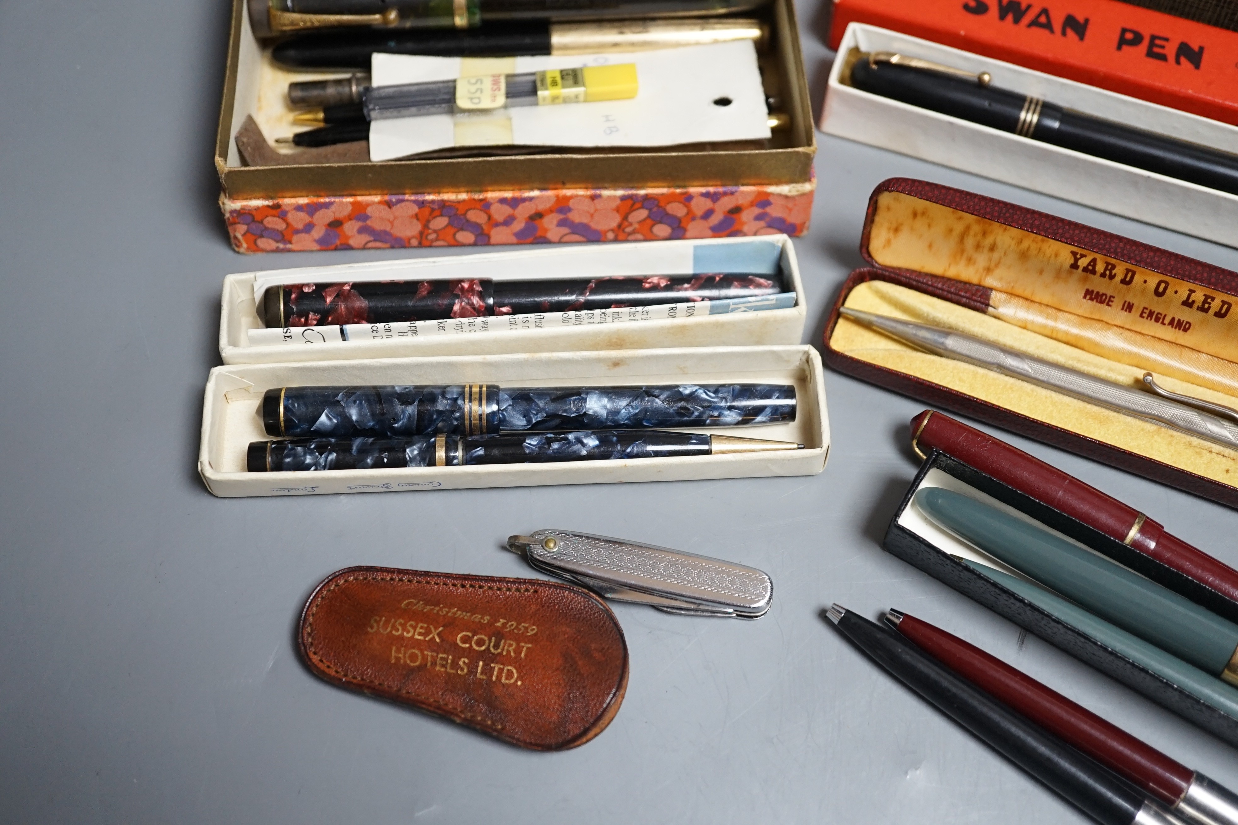 A group of fountain pens and pencils including a Waterman's ideal gold mounted pen